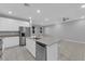 Spacious kitchen with an island, stainless steel appliances, and white cabinetry at 3217 Pergusa Dr, Henderson, NV 89044