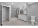 Main bathroom featuring dual vanity, walk-in shower, and tile flooring at 3217 Pergusa Dr, Henderson, NV 89044