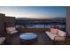 Outdoor balcony with seating area offering panoramic city and mountain views at 410 Tranquil Peak Ct, Henderson, NV 89012