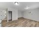 Living area with wood-look floors, white walls, a closet, and access to a bathroom at 4125 Monja Ct, Las Vegas, NV 89104