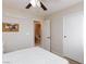 Bedroom with ceiling fan, ensuite bathroom, and neutral walls at 4407 Crimson Tide Ave, North Las Vegas, NV 89031