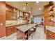 Spacious kitchen featuring granite island, stainless steel appliances, and rich wood cabinets at 46 Moraine Dr, Henderson, NV 89052