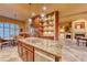 Gourmet kitchen with granite countertops, stainless steel appliances, and custom cabinetry at 46 Moraine Dr, Henderson, NV 89052