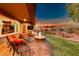 Patio with seating area, fire pit, and view of the backyard at 46 Moraine Dr, Henderson, NV 89052