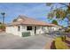 Exterior view of the community pro shop with a golf cart parking area at 4905 Birch Bay Ln, Las Vegas, NV 89130