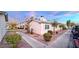 Tan house with landscaped yard and walkway at 4950 Larkspur St, Las Vegas, NV 89120