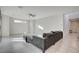 Bright living room with a sectional sofa and ceiling fan at 513 Founders Creek Ave, North Las Vegas, NV 89084