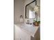 Stylish bathroom with modern fixtures, a marble countertop, and a decorative mirror at 5721 Eugene Ave, Las Vegas, NV 89108