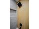 Modern shower stall featuring sleek gray tile and a warm wood-style accent wall at 5721 Eugene Ave, Las Vegas, NV 89108