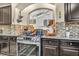 Kitchen boasts stainless steel appliances and stylish mosaic backsplash at 5728 Collier Falls Ave, Las Vegas, NV 89139