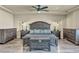 Main bedroom with king bed and wood floors at 5728 Collier Falls Ave, Las Vegas, NV 89139