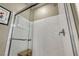 Clean, bright shower with glass door and marble tile walls at 5728 Collier Falls Ave, Las Vegas, NV 89139