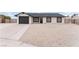 Front exterior of a single-story home with a driveway and attached garage at 5731 Hazen Ct, Las Vegas, NV 89110