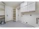 Laundry room with built-in cabinets and shelves at 5731 Hazen Ct, Las Vegas, NV 89110