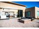 Modern patio with fire pit and sliding glass doors to main living area at 6059 E Spring Mountain Blvd, Pahrump, NV 89048