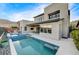 Modern backyard with pool, spa, and covered patio at 6800 Equinox Cliff St, Las Vegas, NV 89135