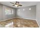 Spacious bedroom with hardwood floors and a ceiling fan at 6953 Graceful Cloud, Henderson, NV 89011