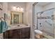 Well-appointed bathroom with a walk-in shower, modern fixtures, and wood-style flooring at 8029 Ancient Oaks Ave, Las Vegas, NV 89113