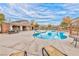 Community pool area with lounge chairs, tables, and restrooms at 8029 Ancient Oaks Ave, Las Vegas, NV 89113