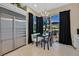 Breakfast nook with stainless steel appliances, dark curtains, and patio access at 8390 Carmel Ridge Ct, Las Vegas, NV 89113