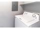 White washer and dryer in a well-lit laundry room at 8777 W Maule Ave # 2127, Las Vegas, NV 89148