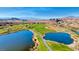 Aerial view of the golf course with lush greens, water features, and mountain views at , Henderson, NV 89011