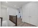 Upstairs hallway with wood railing and white double doors leading to a closet at , Henderson, NV 89011