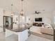 Kitchen featuring island with granite countertops, stainless steel appliances, and a view of the living area at 10308 Rolling Bay Ct, Las Vegas, NV 89141