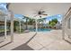 Covered patio with ceiling fan overlooking inviting pool, swing set, and landscaped backyard at 1117 Stable Glen Dr, North Las Vegas, NV 89031