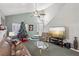 Living room with high ceilings, a Christmas tree, and a view of the entryway stairs at 1179 King Arthur Ct, Henderson, NV 89002