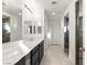 Modern bathroom with double vanity, dark wood cabinetry, and walk-in shower at 157 Ned Lagrotta Ave, Las Vegas, NV 89183