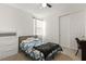 Bright bedroom with carpeted flooring, a bed, and closet with sliding doors at 157 Ned Lagrotta Ave, Las Vegas, NV 89183