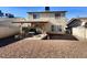 Gravel backyard with patio and seating area at 1817 Amboy Dr, Las Vegas, NV 89108