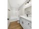 Modern bathroom with white vanity, black fixtures, and tub/shower combo at 2224 Fountain Valley Way, North Las Vegas, NV 89031