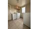 Laundry room with washer, dryer, and tiled floor at 26 Avenue E, McGill, NV 89318