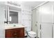 Clean bathroom with shower, toilet and wood vanity at 338 Jett St # 101, Las Vegas, NV 89145