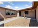 Welcoming front entry with covered porch, security door, and gravel landscaping at 3948 E East Viking Rd, Las Vegas, NV 89121