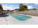 Backyard oasis featuring a refreshing pool with concrete decking and privacy wall at 3948 E East Viking Rd, Las Vegas, NV 89121