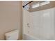 White full bathroom with bathtub, shower and window at 4017 Gaster Ave, North Las Vegas, NV 89081