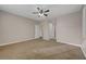 Main bedroom with plush carpeting, ceiling fan, and walk-in closet at 4017 Gaster Ave, North Las Vegas, NV 89081