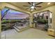 Spacious covered patio with built-in grill, fire pit, and golf course views at 4541 Largo Cantata St, Las Vegas, NV 89135