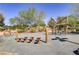 Rustic themed playground with swings and play area at 542 Celebratory Pl, Henderson, NV 89011