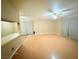 Large open living room with light wood-like floors and a ceiling fan at 6248 Dayton Ave, Las Vegas, NV 89107