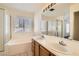 Double sink bathroom with shower and bathtub at 708 Orchid Tree Ln, Henderson, NV 89011