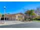 Home features a three-car garage and well-manicured lawn at 10758 Chillingham Dr, Las Vegas, NV 89183