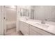 Clean bathroom with double vanity, quartz countertop and bathtub at 10825 Space Odyssey Ave, Las Vegas, NV 89129