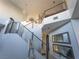 View of the staircase with metal railing leading to the second floor at 11438 Bargetto Ct, Las Vegas, NV 89141