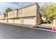 Exterior view of the building with attached garages and a paved driveway at 1851 Hillpointe Rd # 2321, Henderson, NV 89074