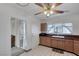 Retro kitchen with brown cabinets and tile floor at 2812 Perliter Ave, North Las Vegas, NV 89030