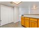 Kitchen with wood cabinets, stainless steel appliances, and tile flooring at 3450 Erva St # 165, Las Vegas, NV 89117